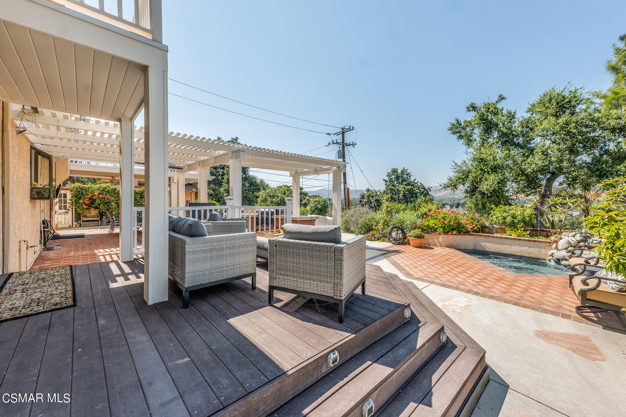 5765 Oak Knolls Road Simi Valley, CA 93063 - Photo 62 of 71 a building outdoor space with patio couch and glass door