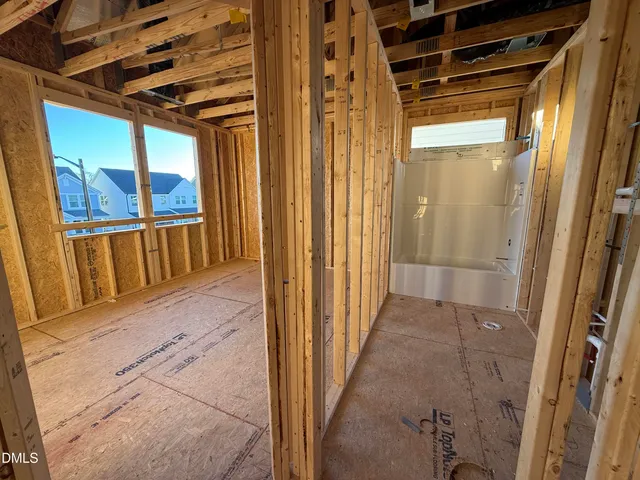 a view of an empty room with glass door