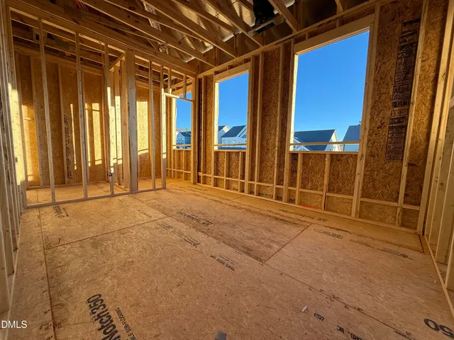a view of a room with wooden walls