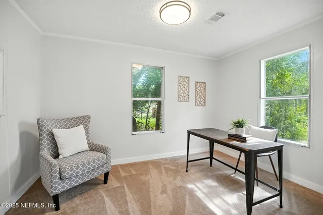 a living room with furniture and a window