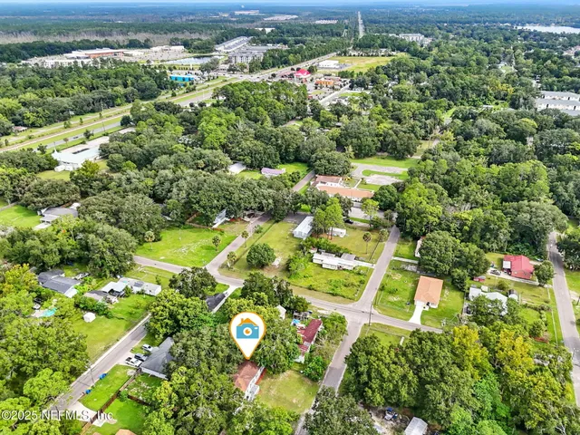 an aerial view of residential houses with outdoor space