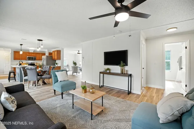a living room with furniture and a flat screen tv