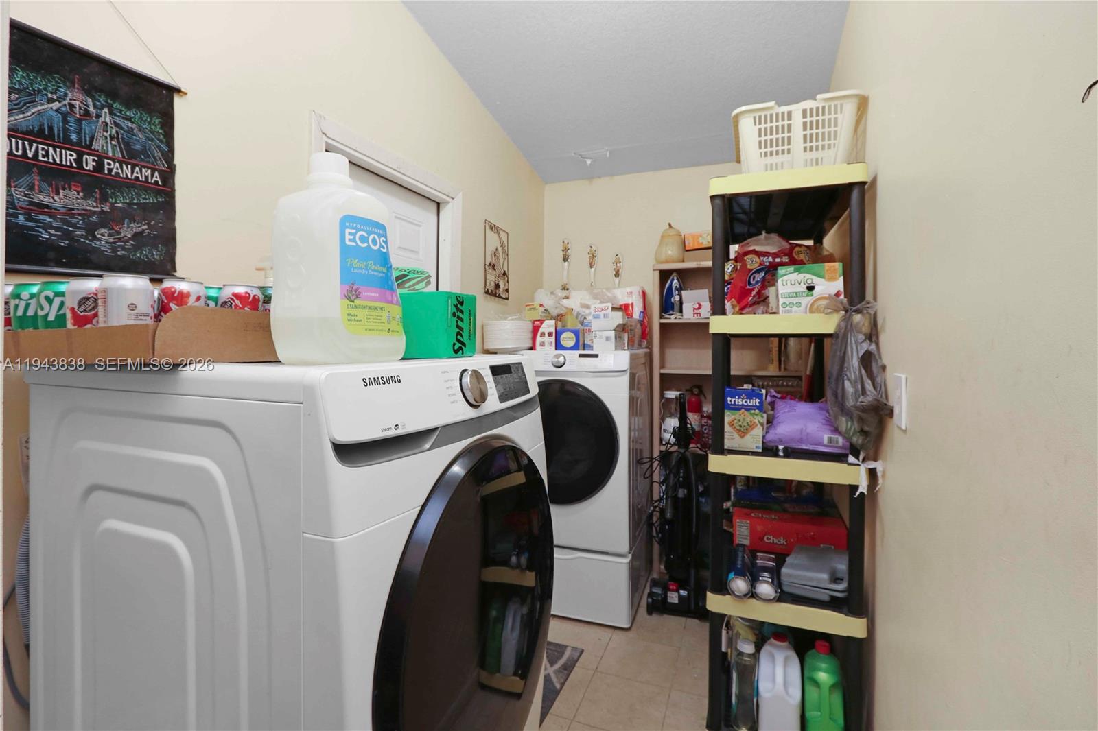 13243 Southwest 258th Terrace Homestead, FL 33032 - Photo 11 of 25 a utility room with dryer washer and a fireplace