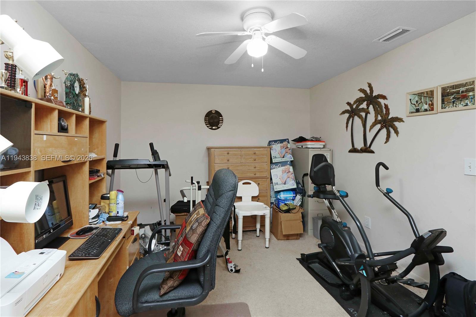13243 Southwest 258th Terrace Homestead, FL 33032 - Photo 12 of 25 a view of a room with gym equipment