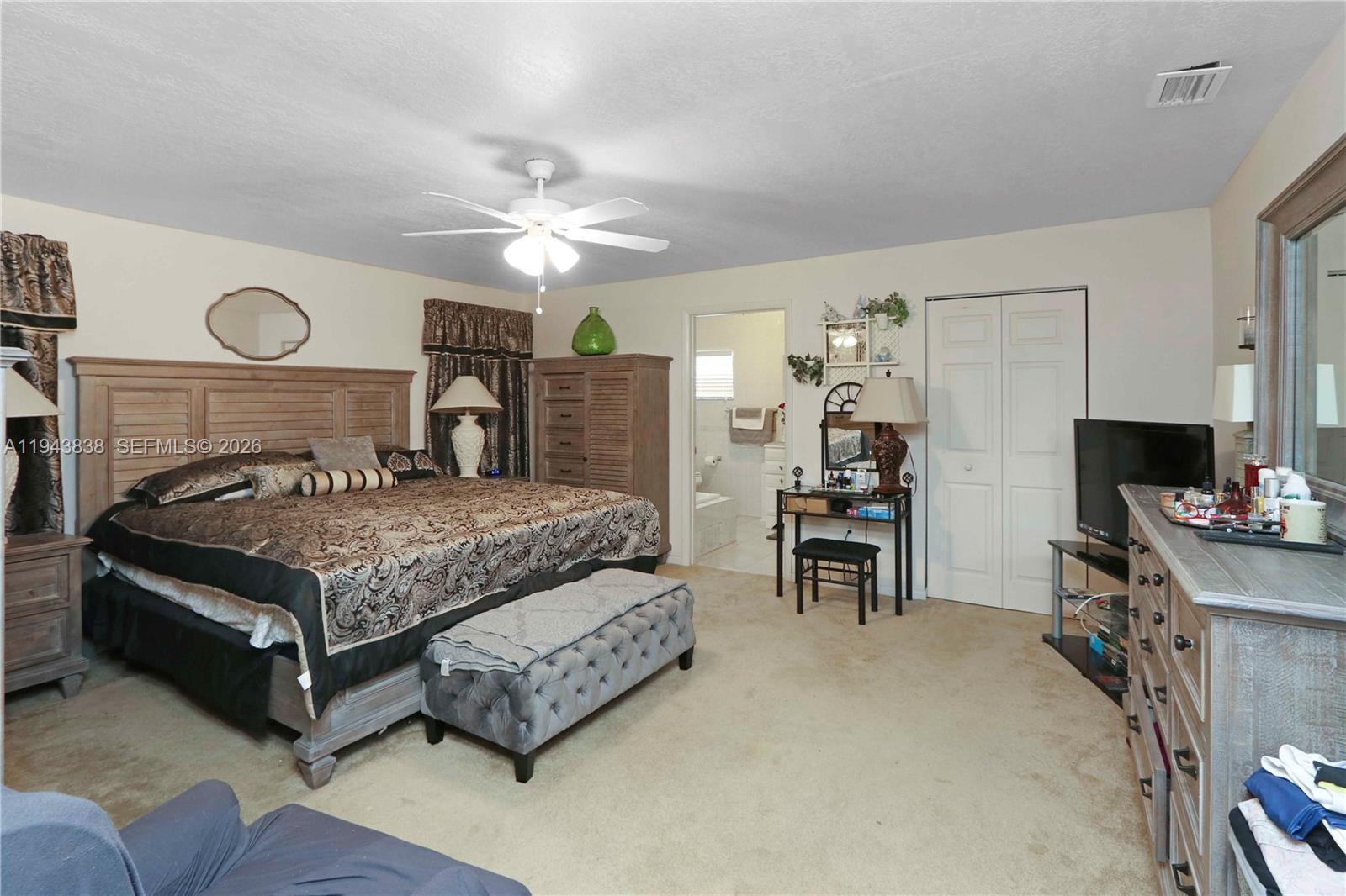 13243 Southwest 258th Terrace Homestead, FL 33032 - Photo 15 of 25 a living room with furniture and a fireplace