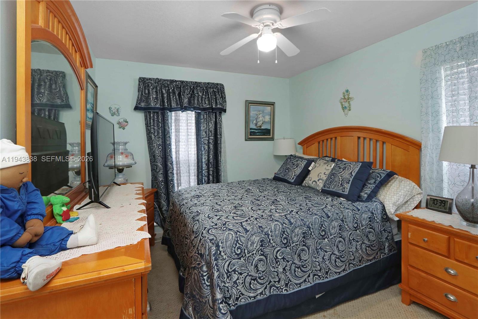 13243 Southwest 258th Terrace Homestead, FL 33032 - Photo 17 of 25 a bedroom with a bed dresser and a window