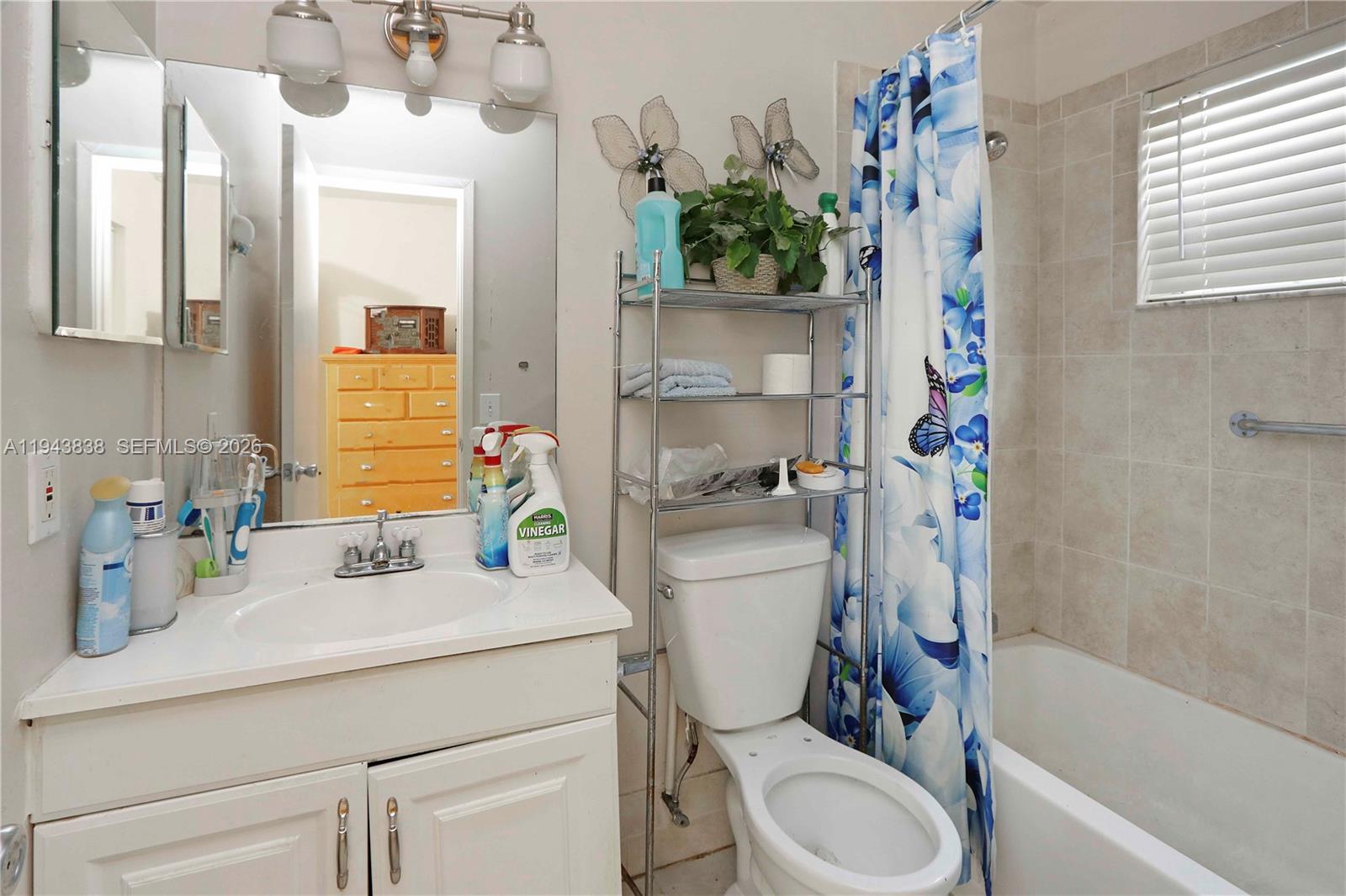 13243 Southwest 258th Terrace Homestead, FL 33032 - Photo 19 of 25 a bathroom with a sink toilet vanity tub and shower