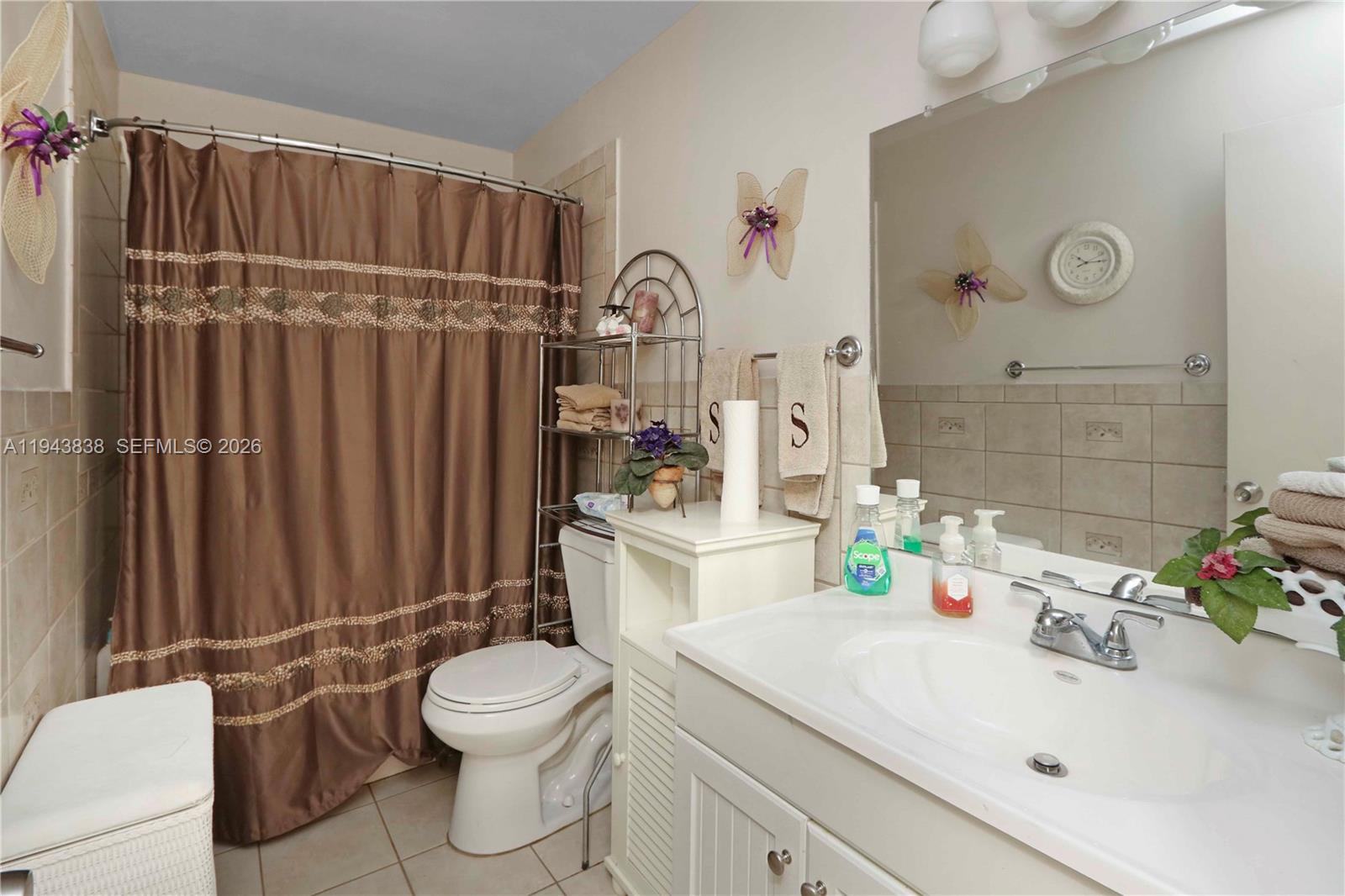 13243 Southwest 258th Terrace Homestead, FL 33032 - Photo 20 of 25 a bathroom with a sink a toilet and shower
