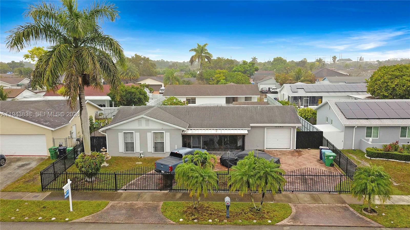 13243 Southwest 258th Terrace Homestead, FL 33032 - Photo 2 of 25 a aerial view of a house with a yard