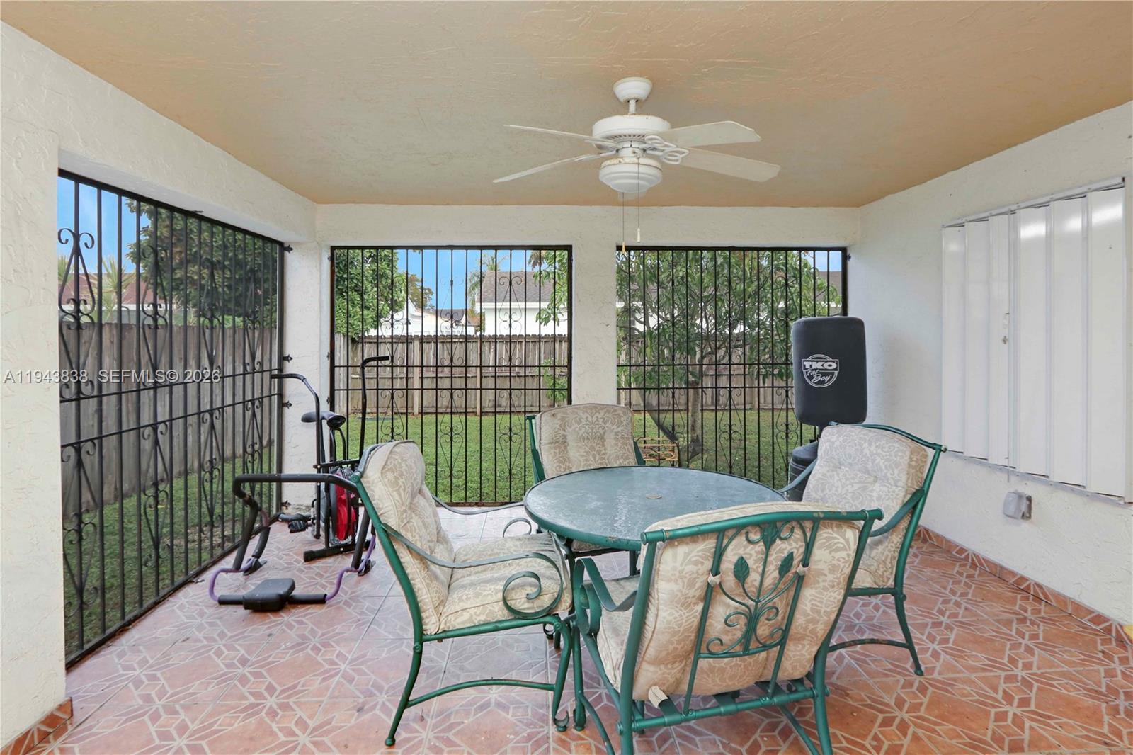 13243 Southwest 258th Terrace Homestead, FL 33032 - Photo 21 of 25 a view of a dining room with furniture window and outside view