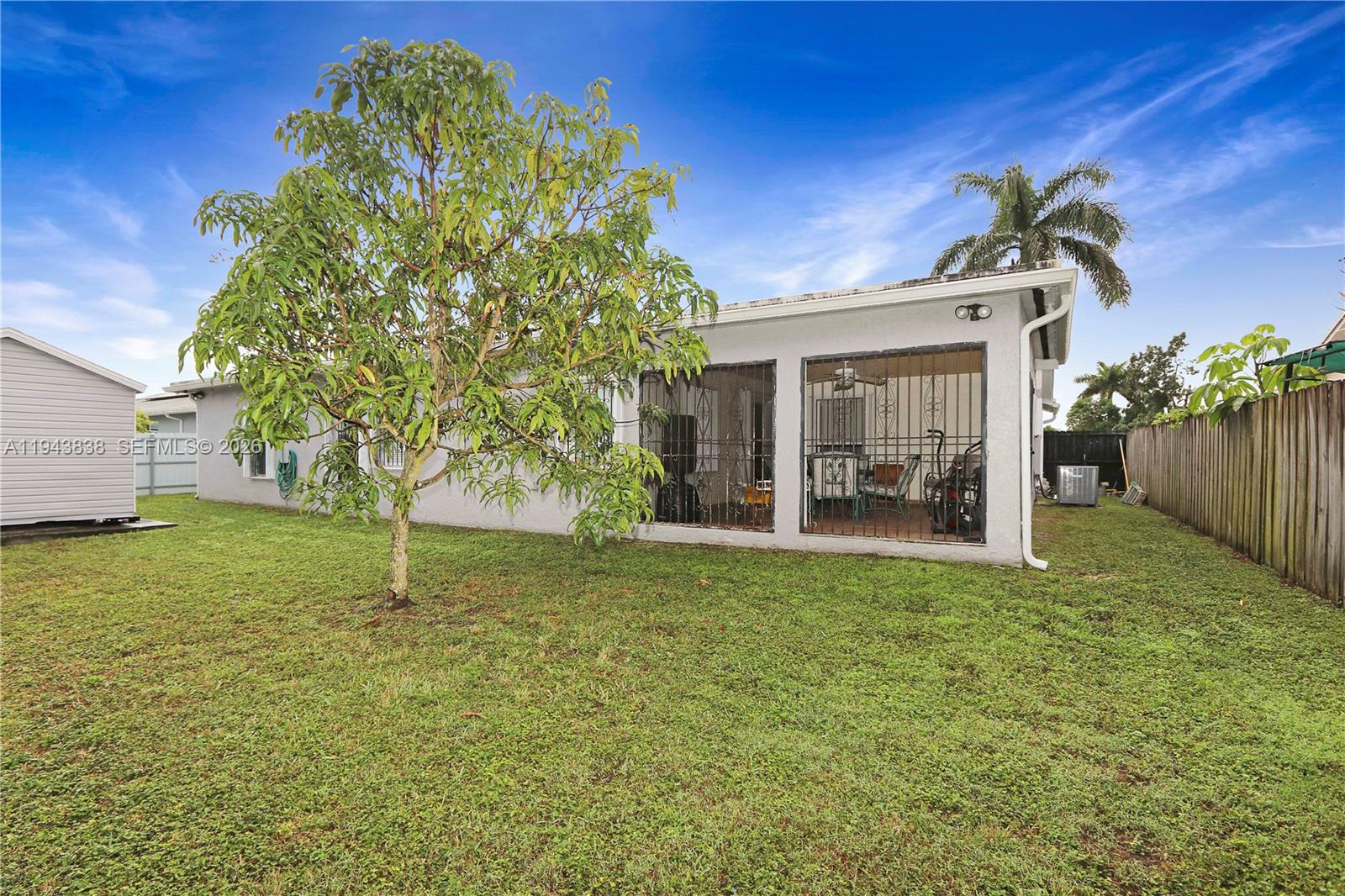 13243 Southwest 258th Terrace Homestead, FL 33032 - Photo 22 of 25 a view of a house with backyard and garden