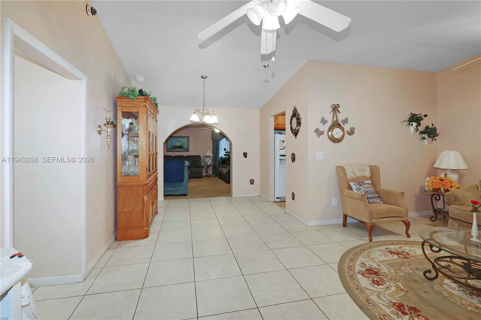 13243 Southwest 258th Terrace Homestead, FL 33032 - Photo 3 of 25 a view of a livingroom with furniture and a chandelier