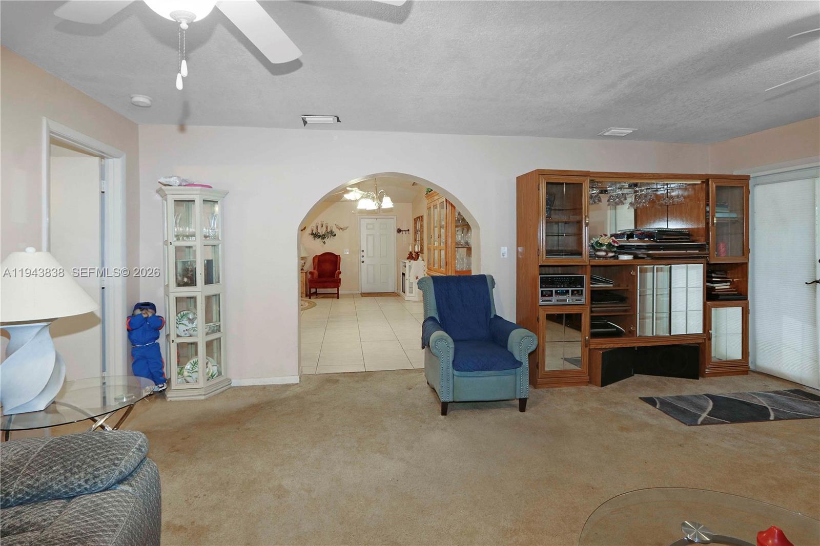 13243 Southwest 258th Terrace Homestead, FL 33032 - Photo 8 of 25 a living room with furniture and a flat screen tv