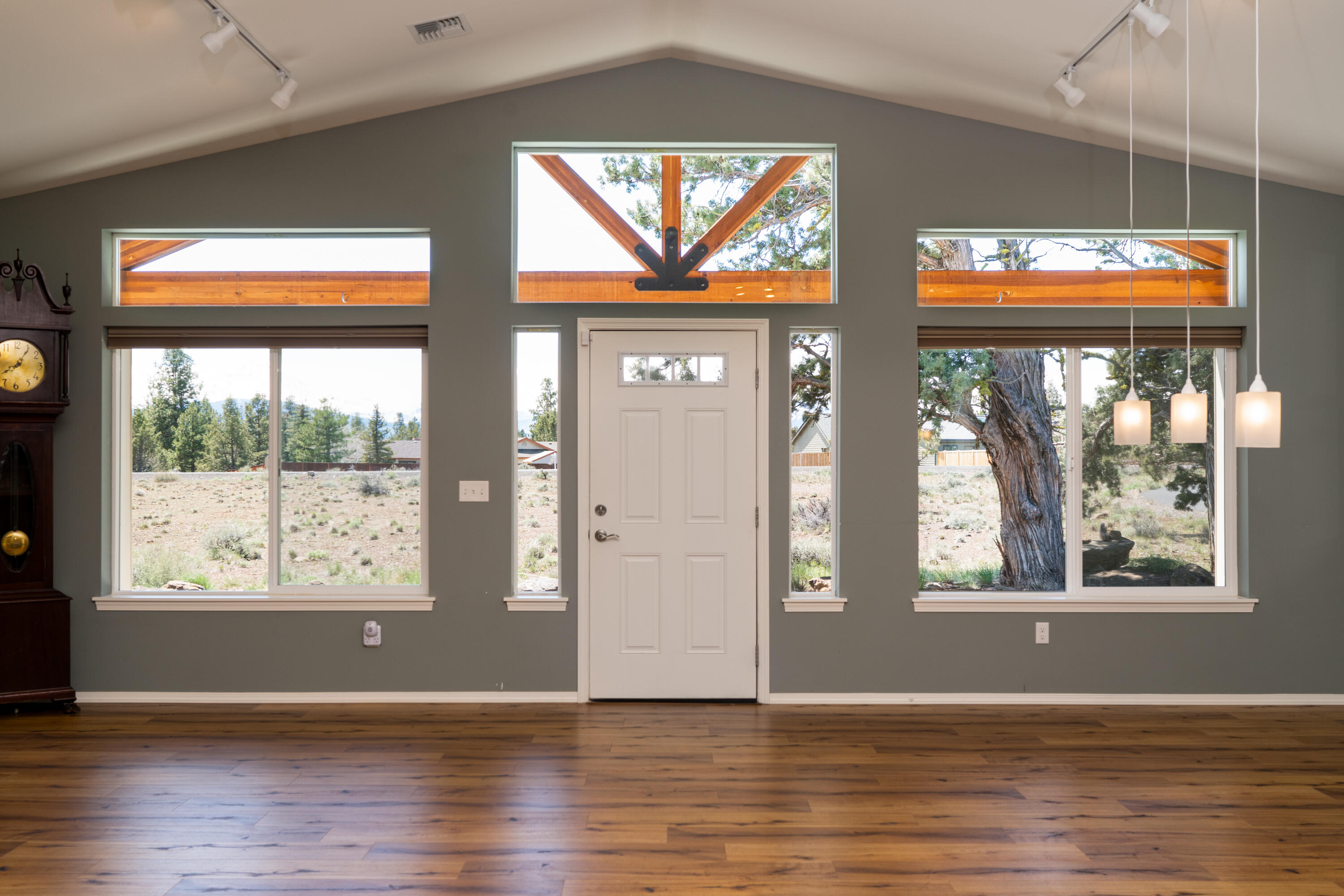70099 Indian Ford Road Sisters, OR 97759 - Photo 11 of 27 a view of an empty room with wooden floor and a window