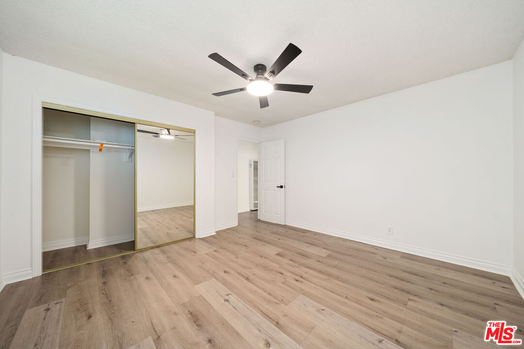 8933 Cadillac Avenue, Unit 4 Los Angeles, CA 90034 - Photo 11 of 17 a view of an empty room and wooden floor