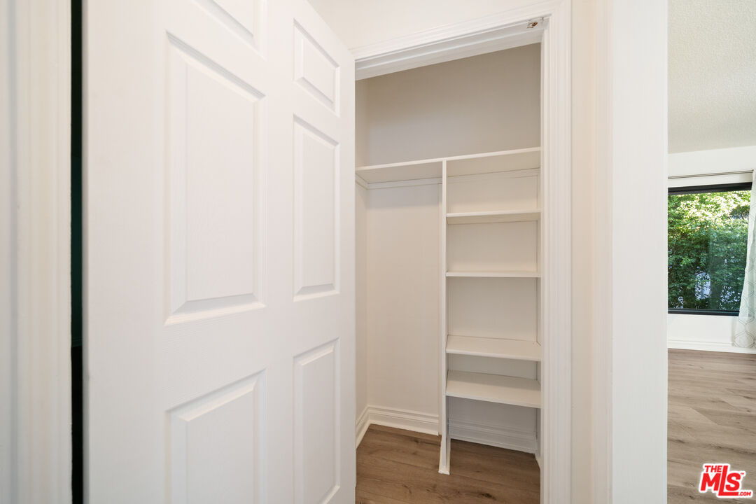 8933 Cadillac Avenue, Unit 4 Los Angeles, CA 90034 - Photo 16 of 17 a view of walk in closet with empty racks