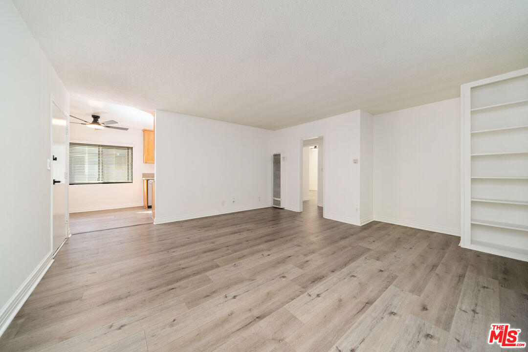 8933 Cadillac Avenue, Unit 4 Los Angeles, CA 90034 - Photo 5 of 17 a view of an empty room and wooden floor