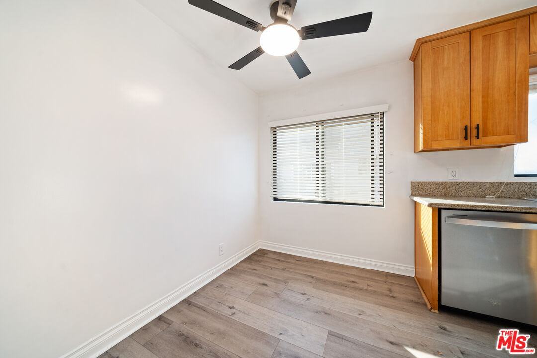 8933 Cadillac Avenue, Unit 4 Los Angeles, CA 90034 - Photo 6 of 17 a kitchen with a wooden floor and a window
