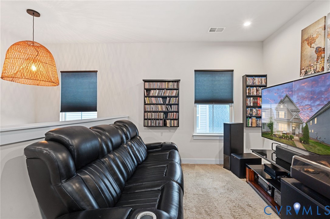 1605 German School Road Richmond, VA 23225 - Photo 13 of 27 a living room with furniture a flat screen tv and a window