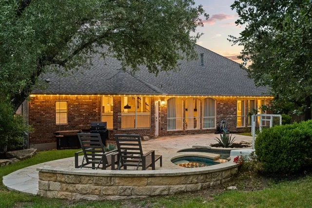 a view of a swimming pool with a patio