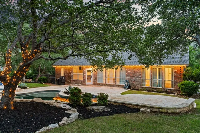 swimming pool view with a seating space