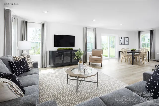 a living room with furniture or couch and a flat screen tv