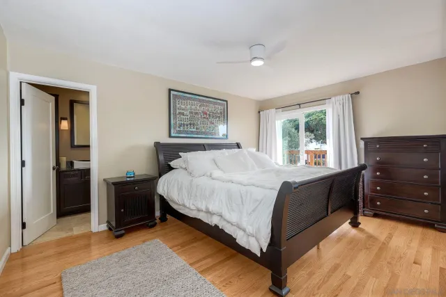 a bed room with a bed and dresser