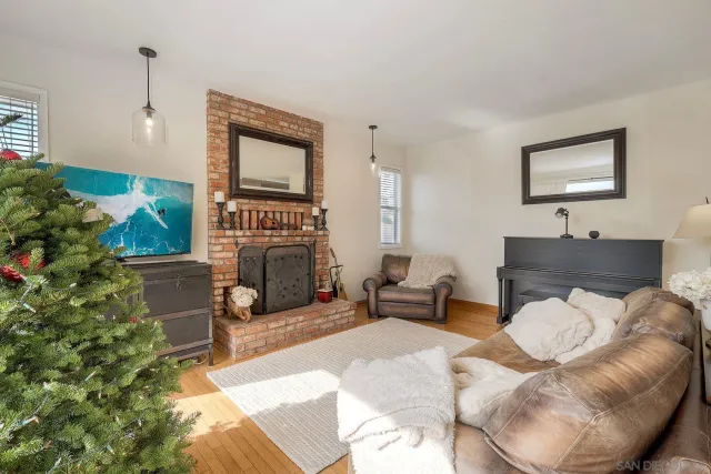 a living room with furniture a window and a fireplace
