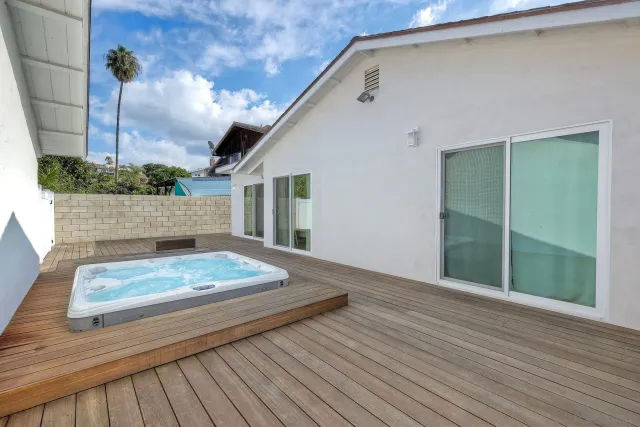 a view of wooden floor and brick wall