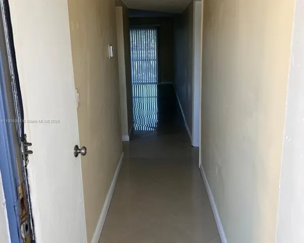 a view of a hallway with a white walls