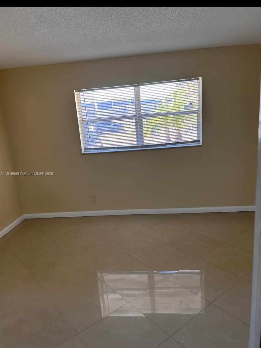 7920 North Colony Circle, Unit 107 Tamarac, FL 33321 - Photo 7 of 11 a view of a window in a room