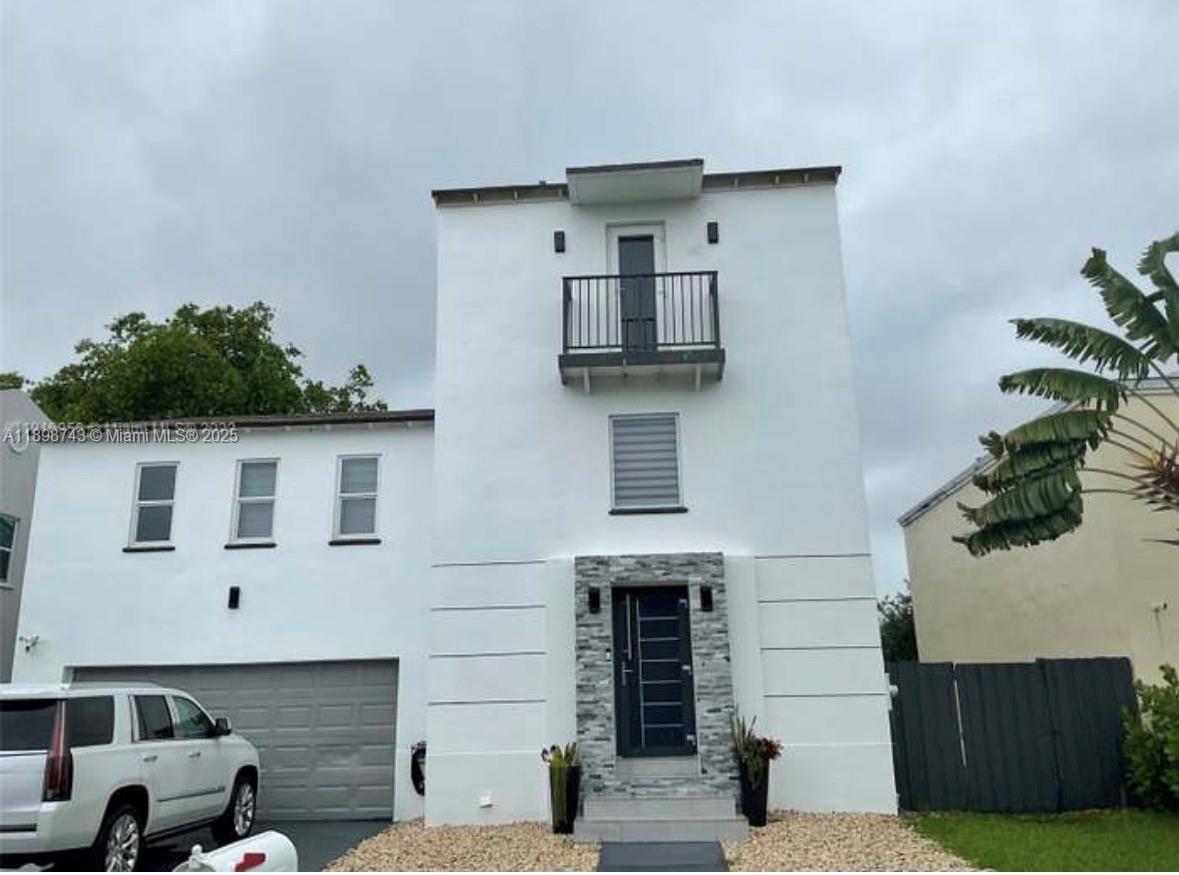 a kitchen with a sink and a microwave