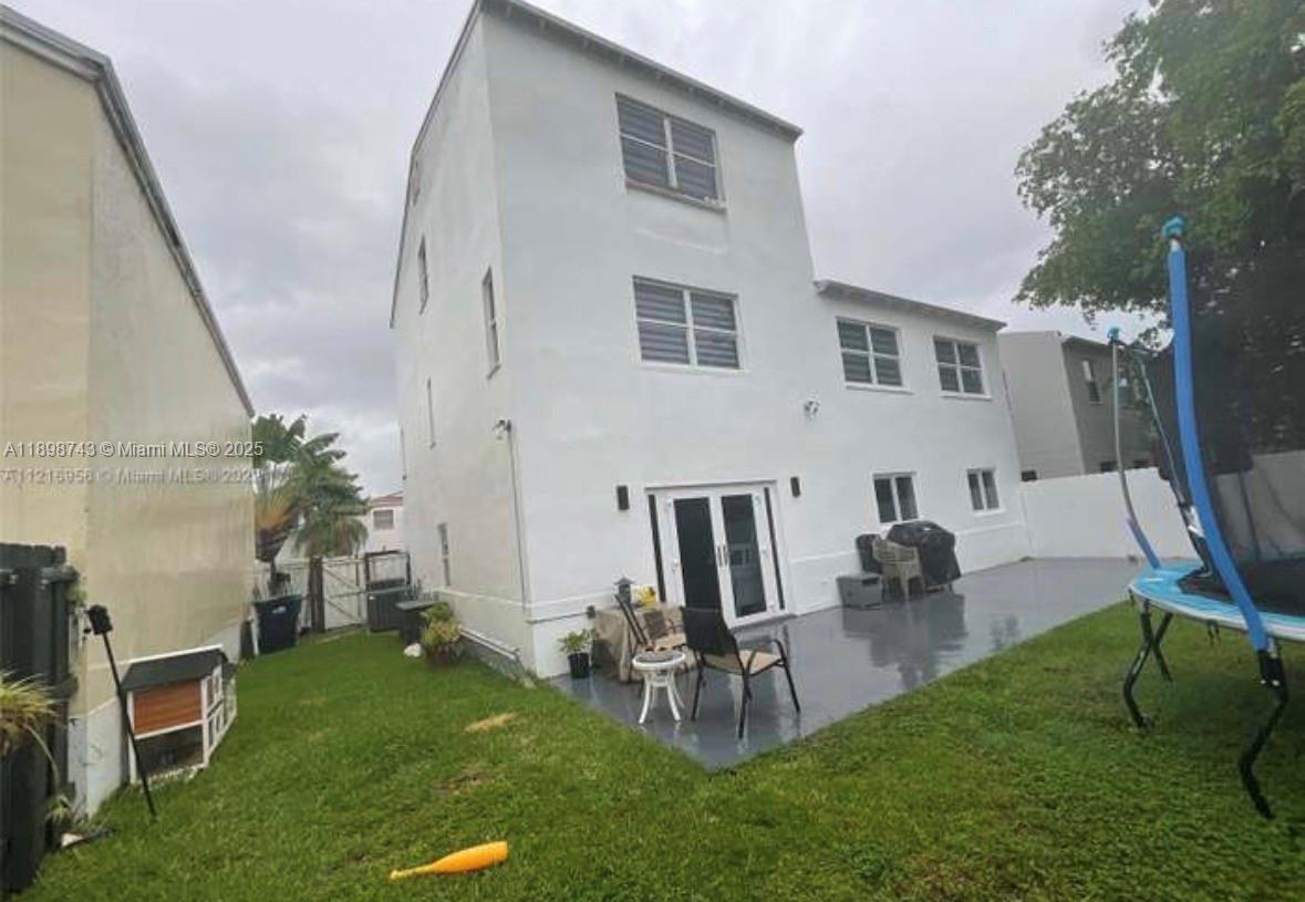 12100 Southwest 271st Street, Unit 12100 Homestead, FL 33032 - Photo 21 of 24 a view of yard from outdoor seating