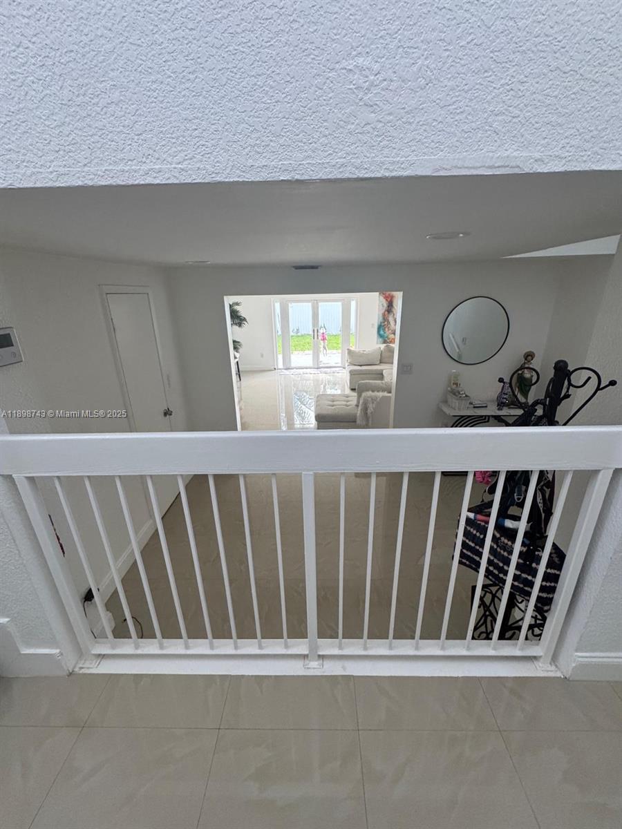 12100 Southwest 271st Street, Unit 12100 Homestead, FL 33032 - Photo 3 of 24 a view of a porch with furniture