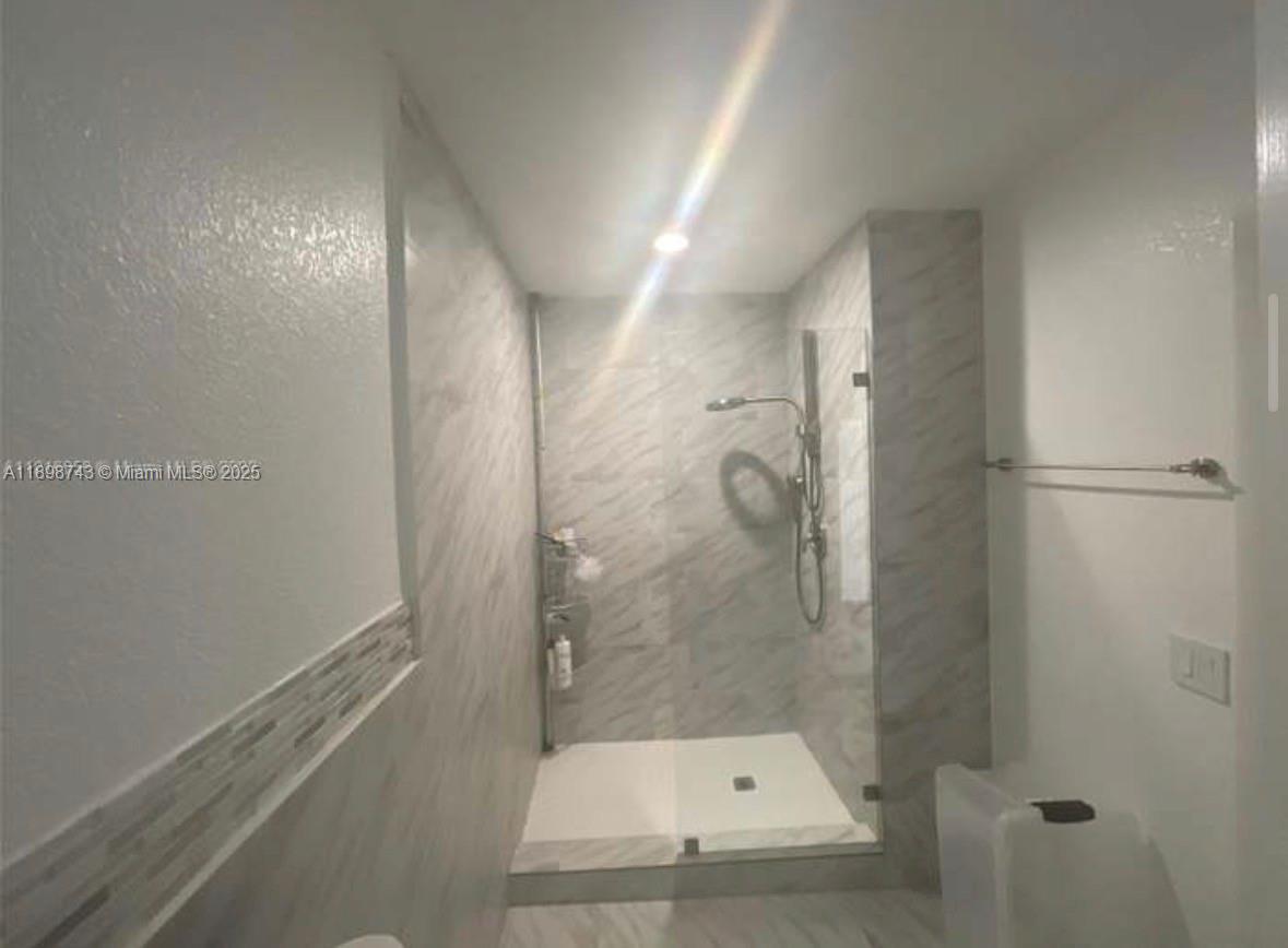 12100 Southwest 271st Street, Unit 12100 Homestead, FL 33032 - Photo 8 of 24 a bathroom with a shower