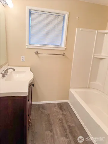 a bathroom with a sink and a bathtub