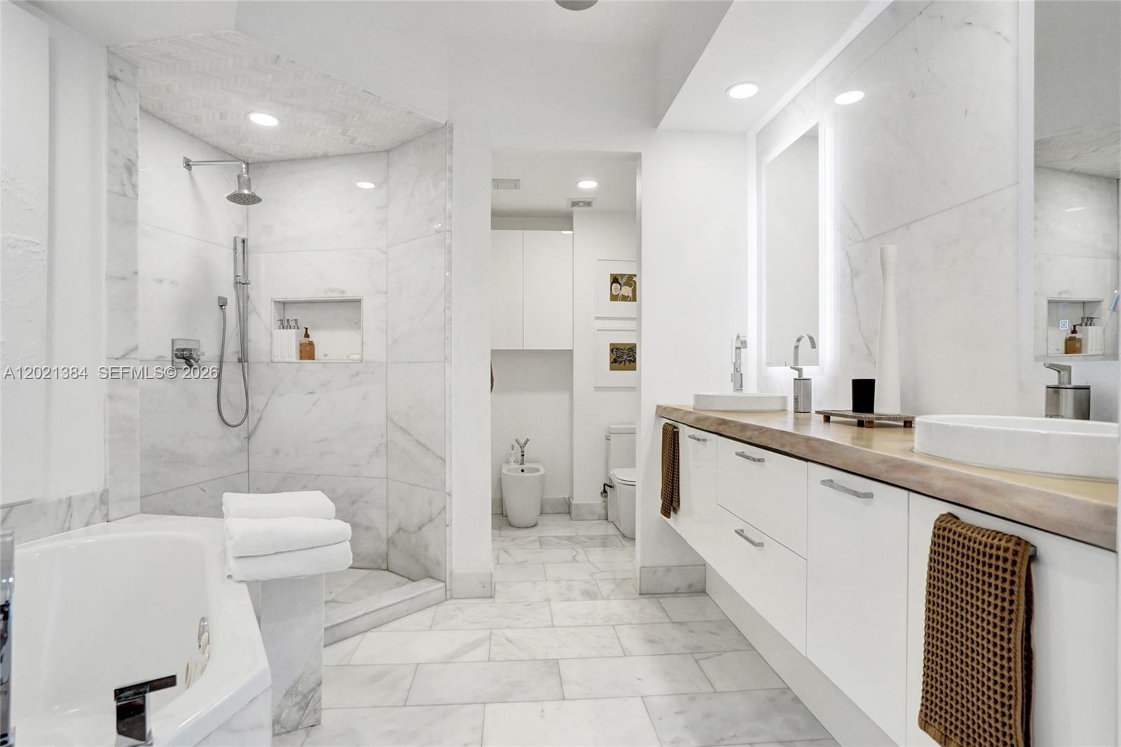 400 Alton Road, Unit PH11 Miami Beach, FL 33139 - Photo 28 of 49 a large bathroom with a sink a toilet and shower