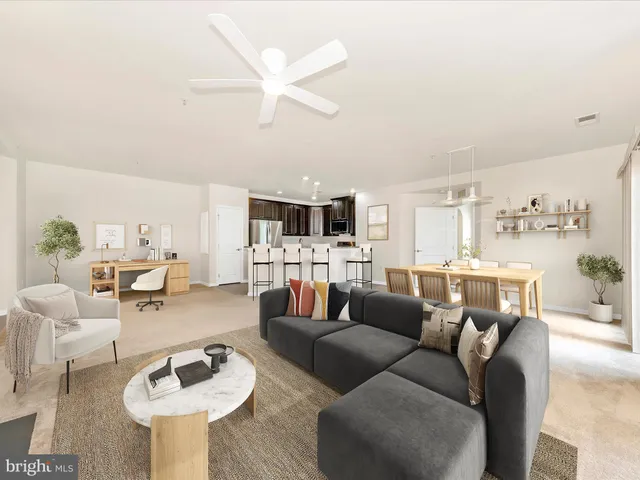 an empty room with a empty space and a ceiling fan