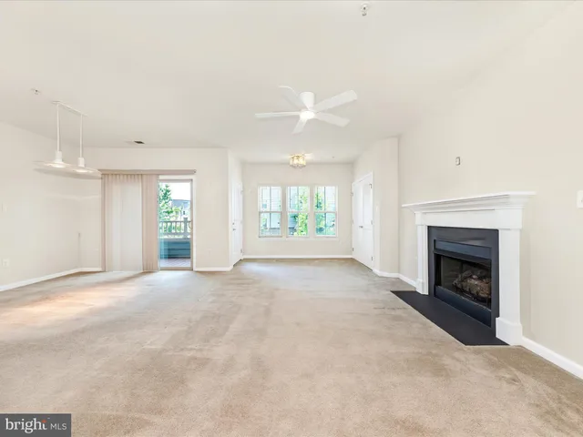 an empty room with windows and entrance