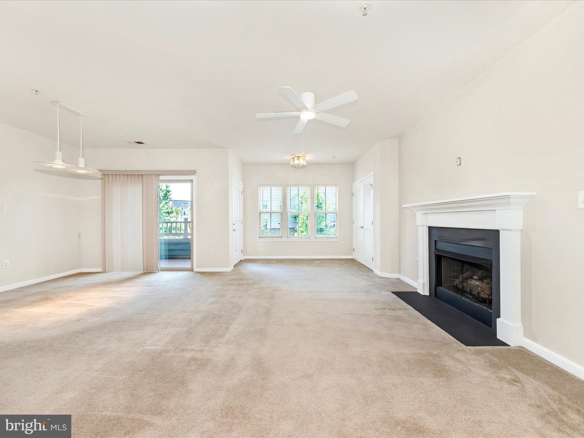 6501 Walcott Lane, Unit 202 Frederick, MD 21703 - Photo 17 of 53 an empty room with windows and fireplace