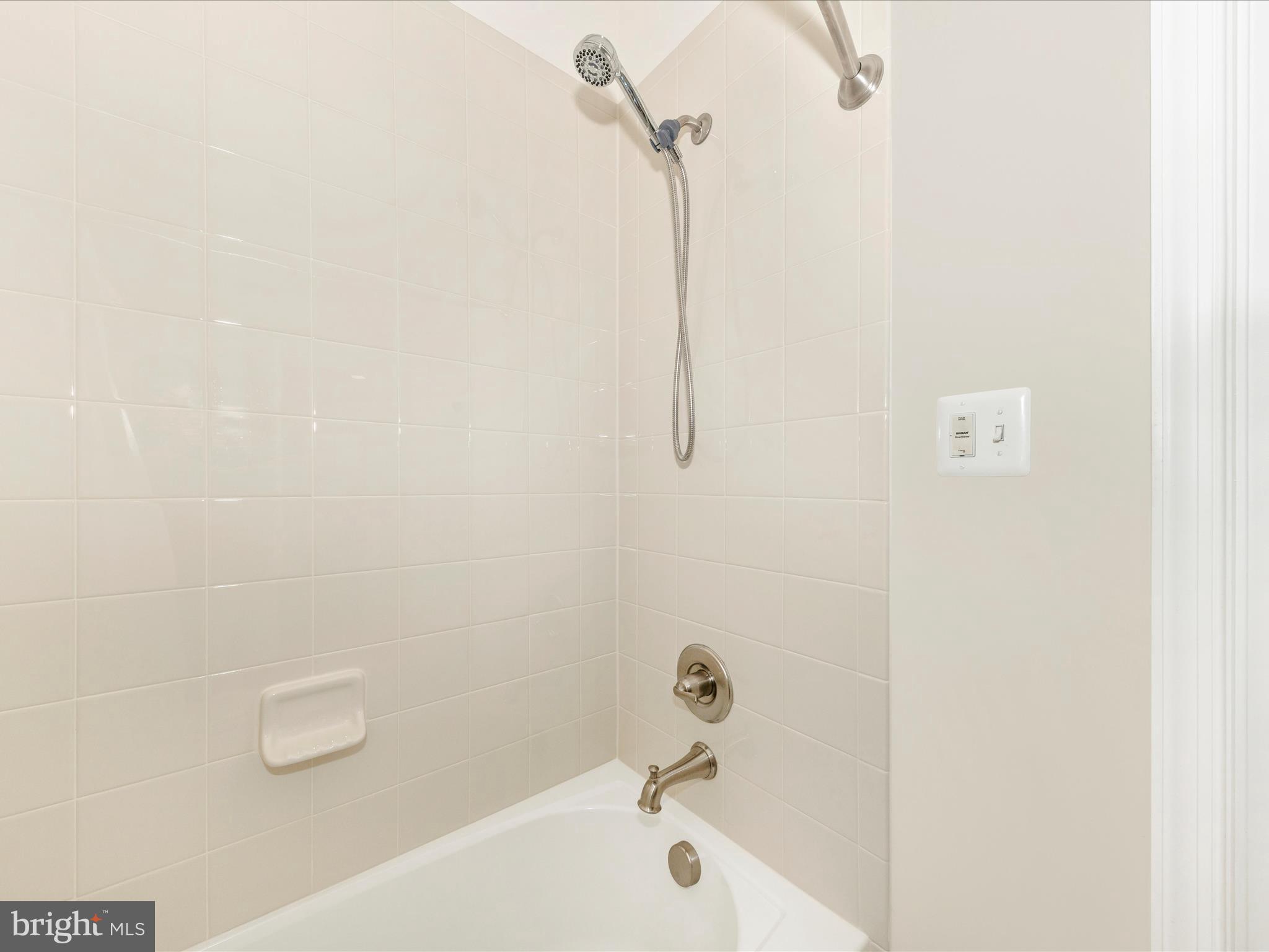 6501 Walcott Lane, Unit 202 Frederick, MD 21703 - Photo 31 of 53 a bathroom with a bathtub