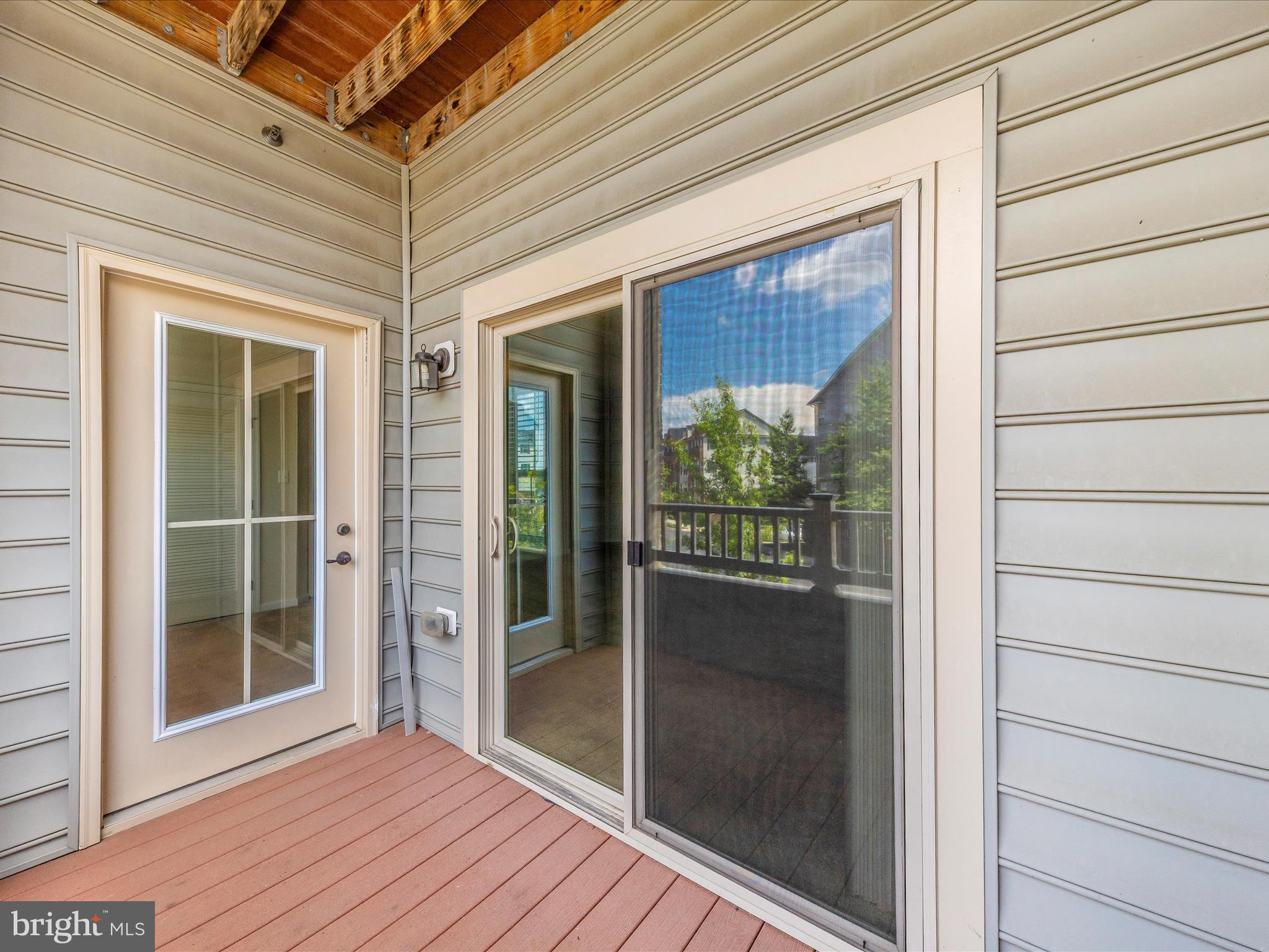 6501 Walcott Lane, Unit 202 Frederick, MD 21703 - Photo 35 of 53 a view of a glass door with a glass door