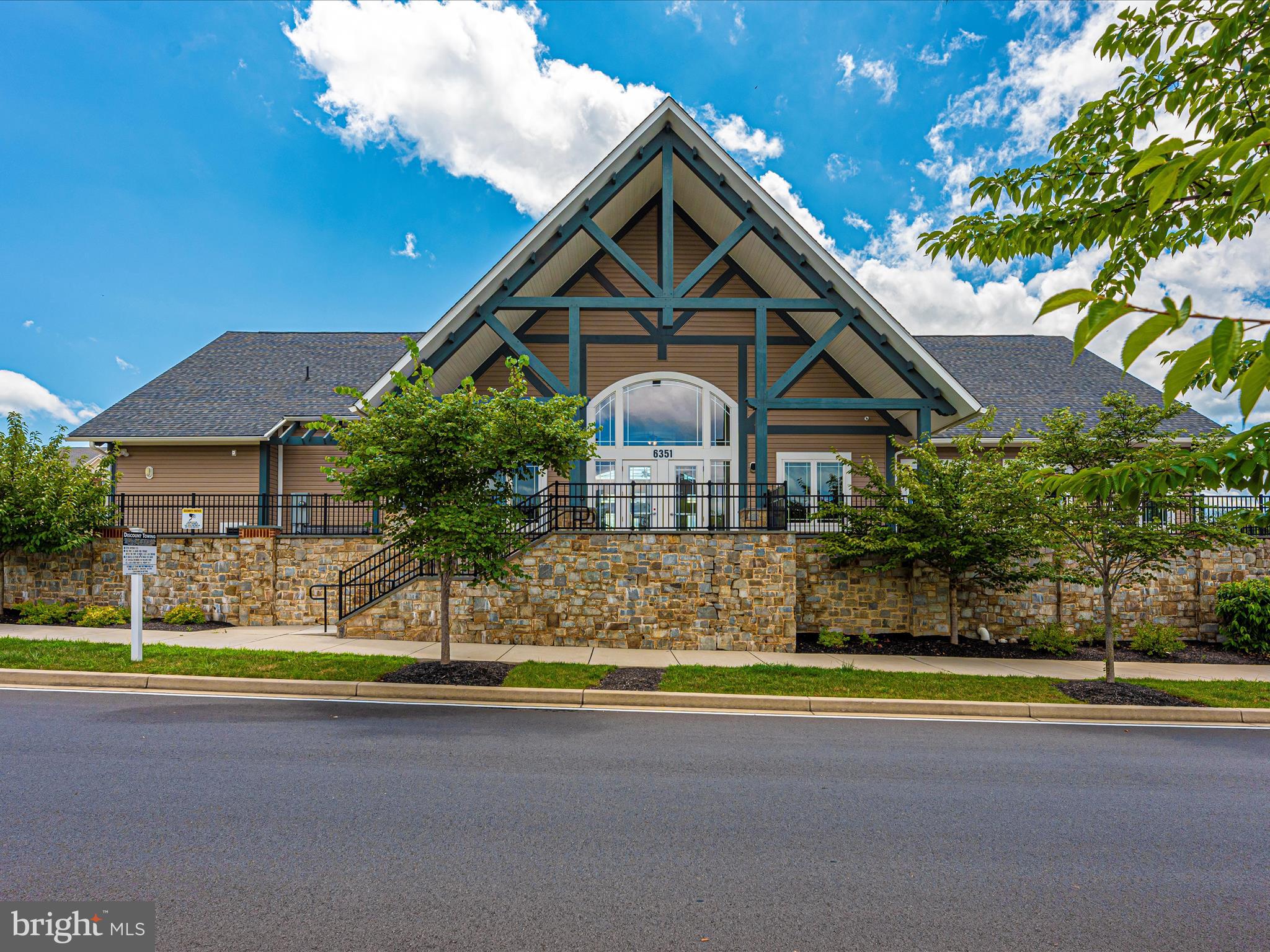6501 Walcott Lane, Unit 202 Frederick, MD 21703 - Photo 40 of 53 a front view of a house with a yard