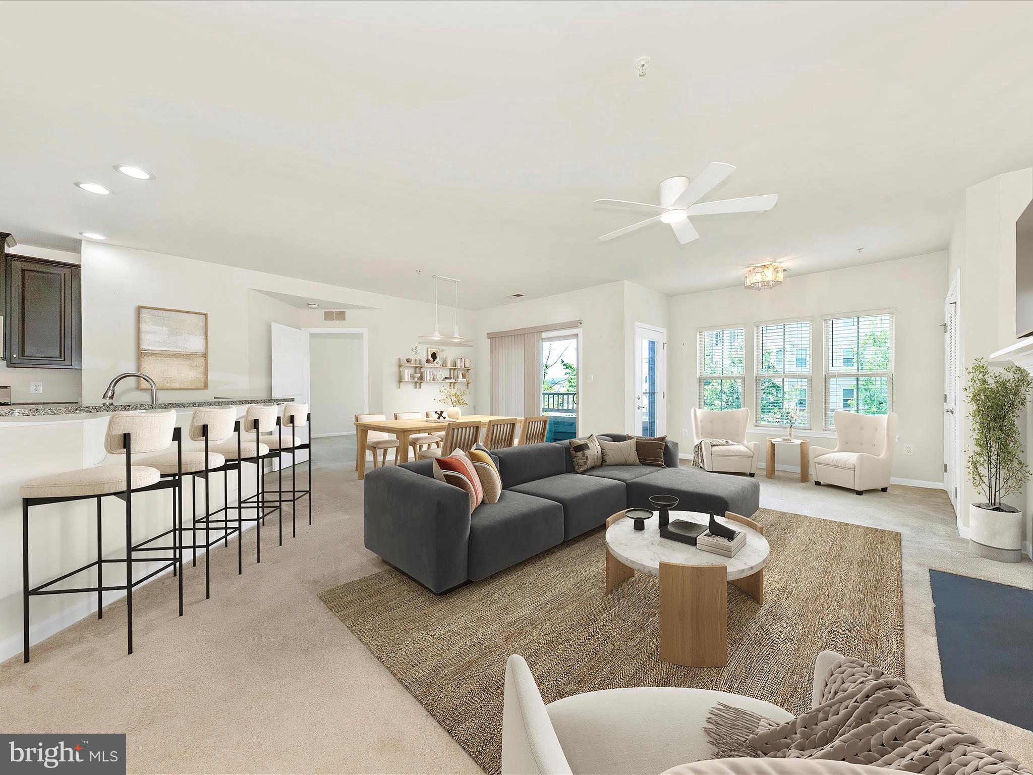 6501 Walcott Lane, Unit 202 Frederick, MD 21703 - Photo 4 of 53 a living room with furniture kitchen view and a large window