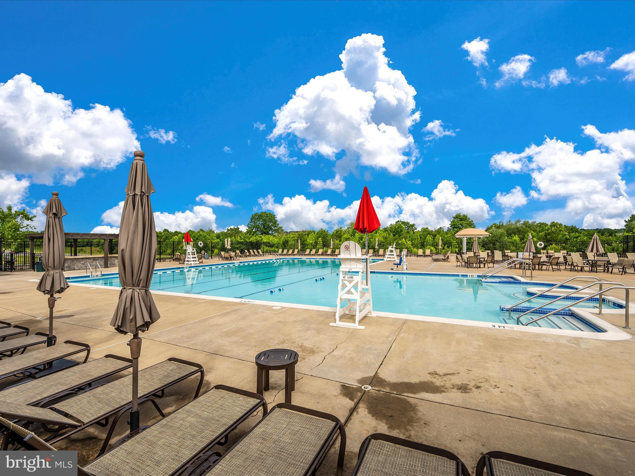 6501 Walcott Lane, Unit 202 Frederick, MD 21703 - Photo 43 of 53 a view of a lake and outdoor seating