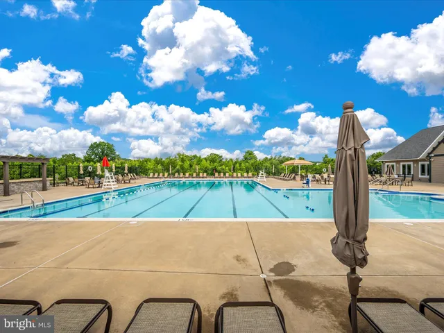 a front view of a residential apartment building with a yard
