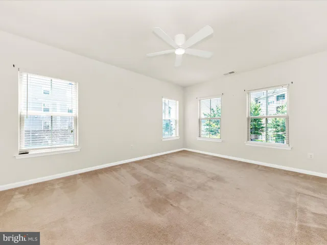 a bathroom with a double vanity sink toilet and mirror