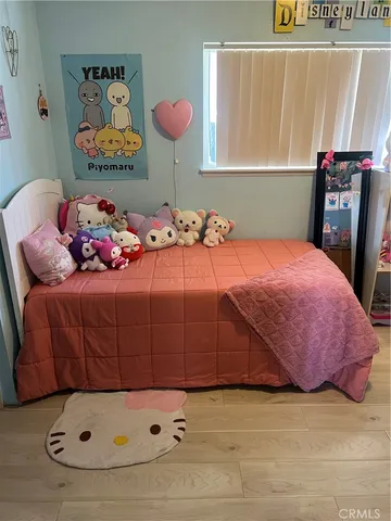 a bedroom with a bed and dresser