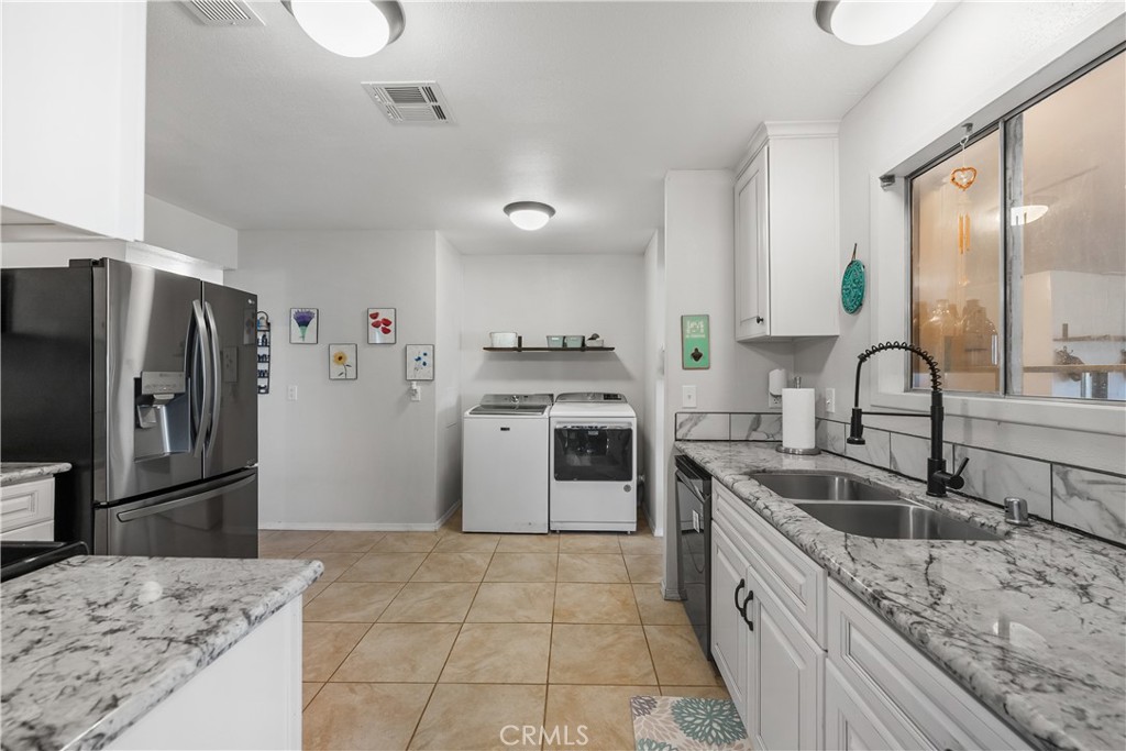 13336 Clement Edwards, CA 93523 - Photo 12 of 56 a kitchen with a sink refrigerator and microwave