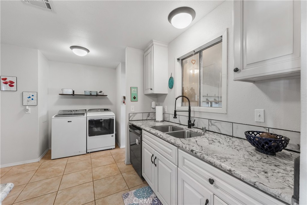 13336 Clement Edwards, CA 93523 - Photo 13 of 56 a kitchen with a sink stove and cabinets